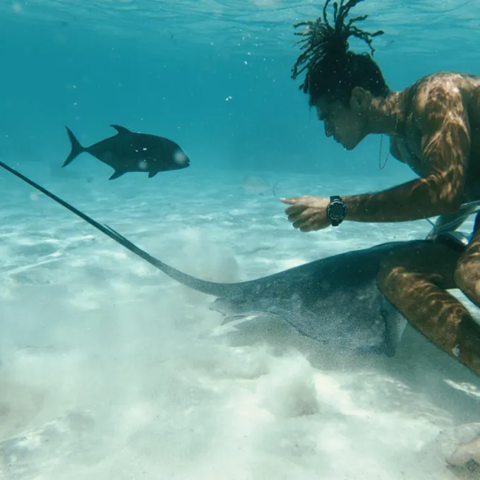 a man swimming in a body of water