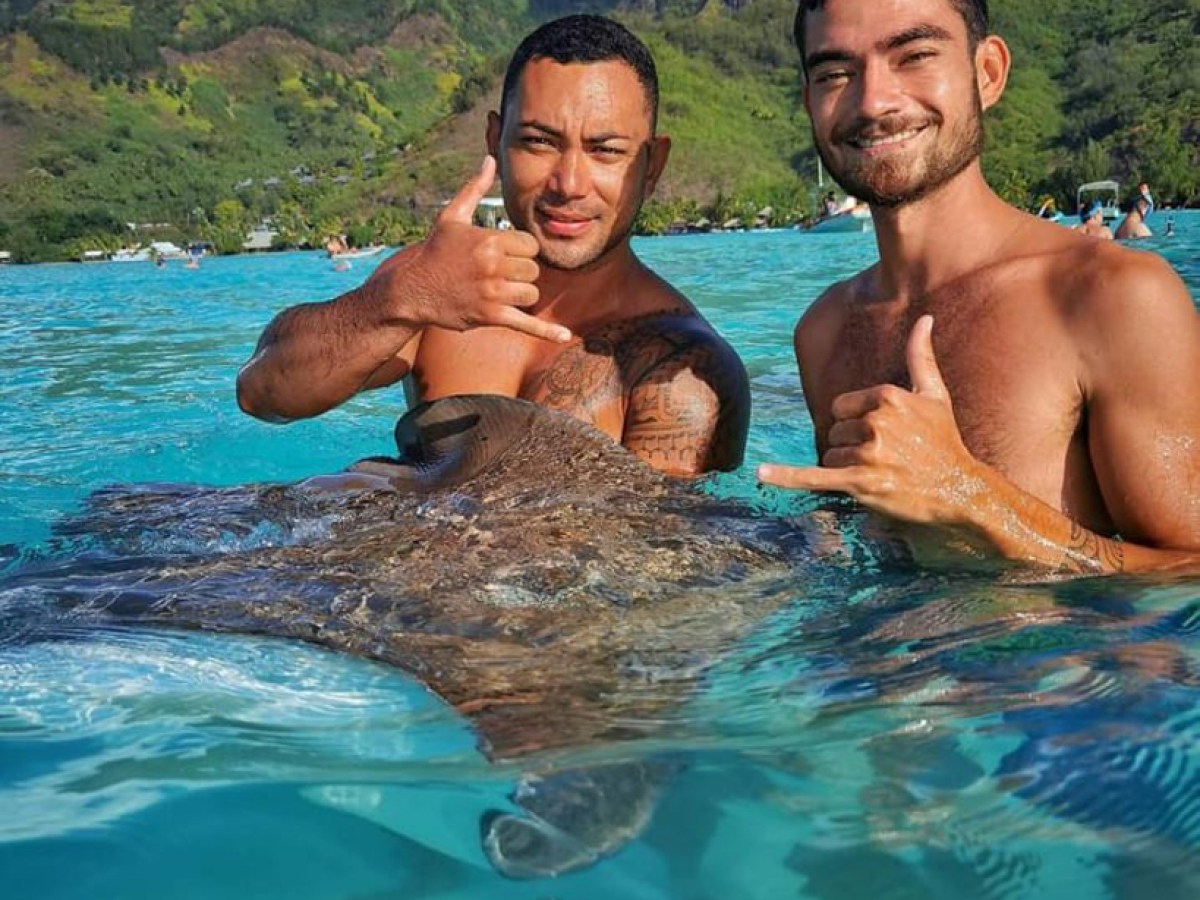 a man swimming in a body of water