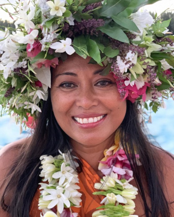CT a woman in a pink flower on a plant